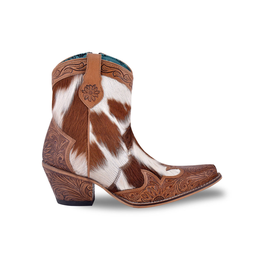 Hair-on hide and hand-tooled leather ankle boots in brown and white with a snip toe and decorative floral detailing.