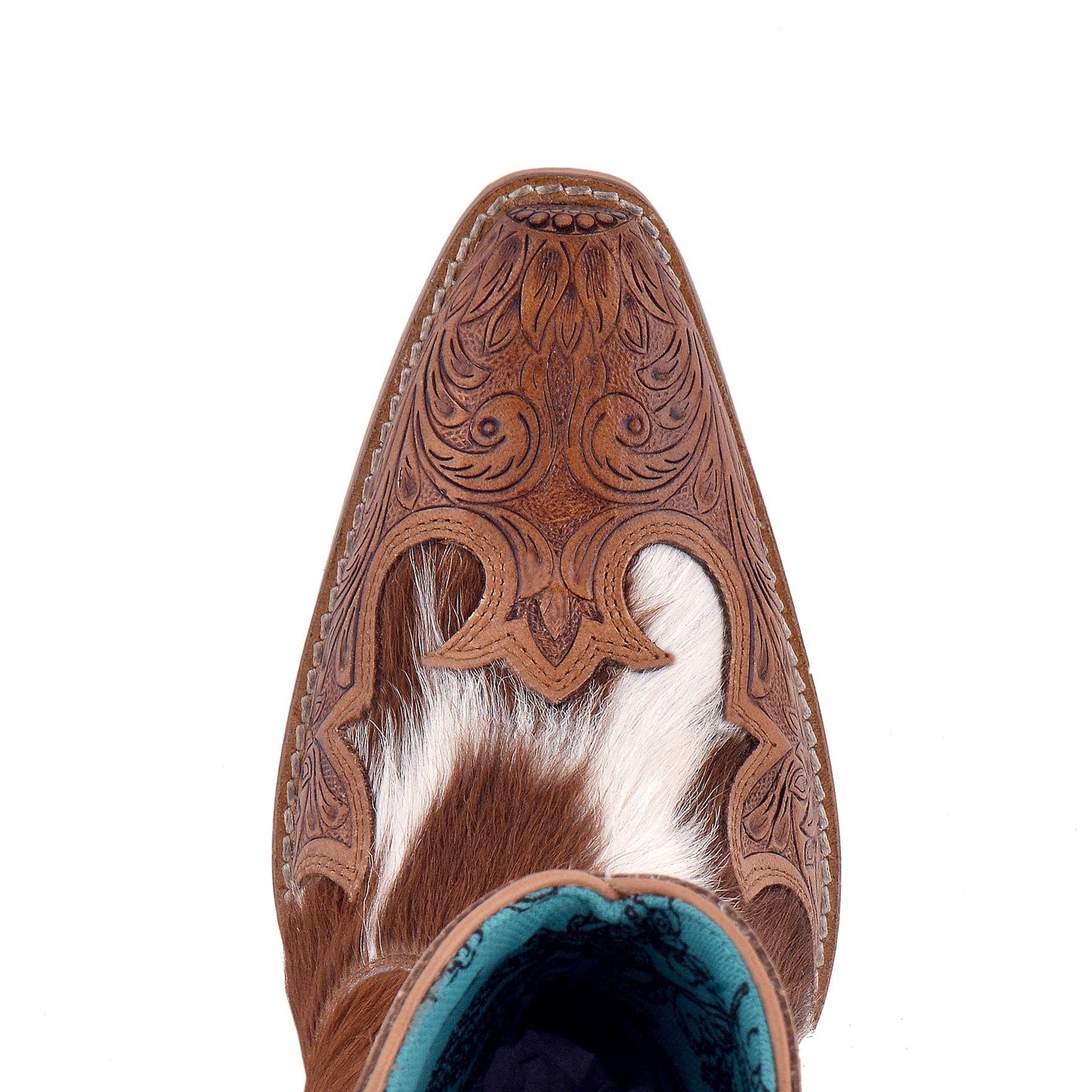 Hand-tooled leather boots featuring a snip toe, with a mix of brown hair-on hide and intricate embossed patterns.