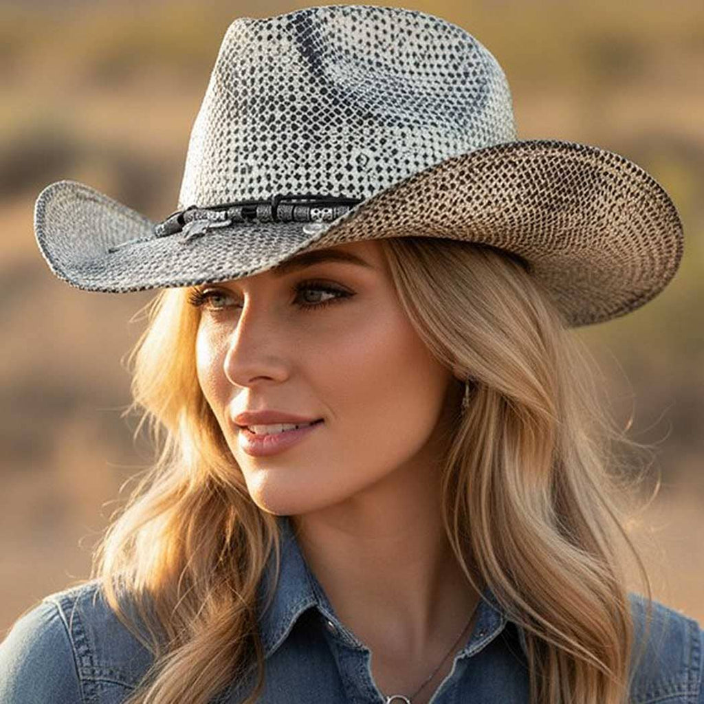 Handmade vintage cowboy hat in light gray with a structured crown, featuring western-themed charms and a curved brim.