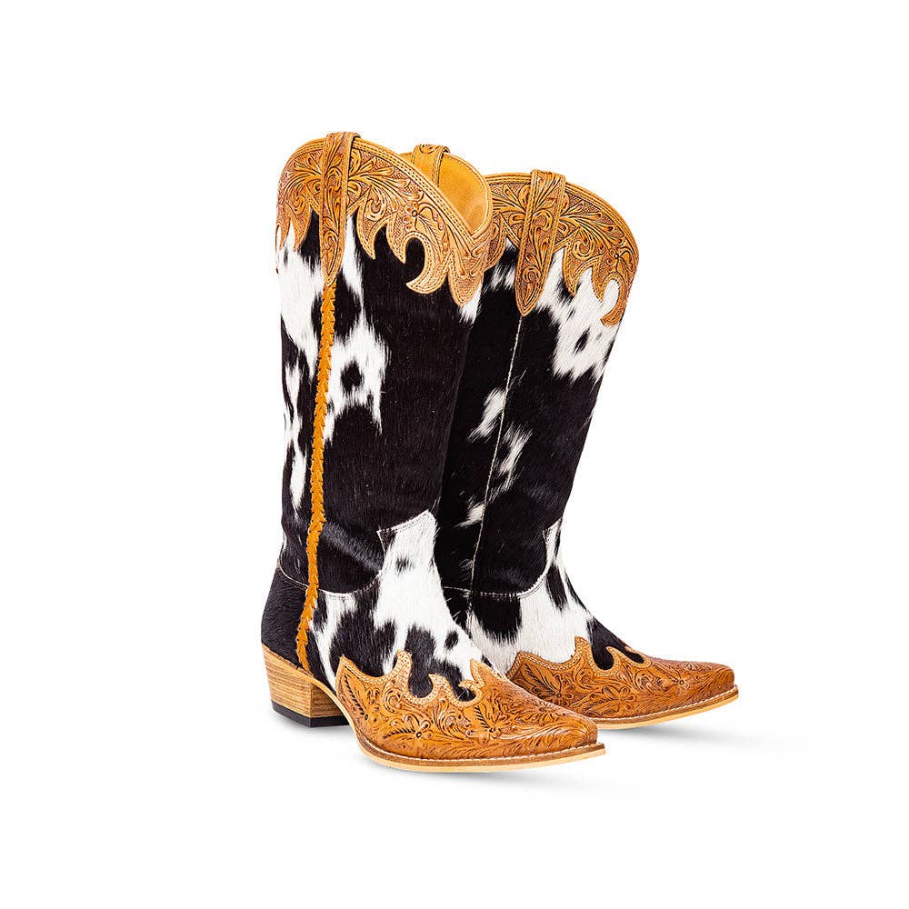 High top boots featuring black and white hair-on leather with hand-tooled honey leather accents and snip toe.