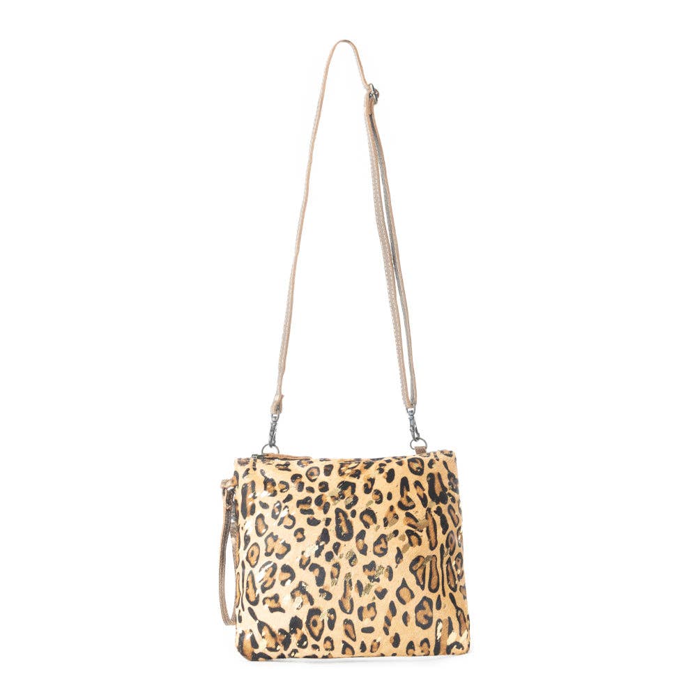 Leopard print bag featuring gold specks, with a crossbody strap and leather accents, size 9.75 x 8 inches.