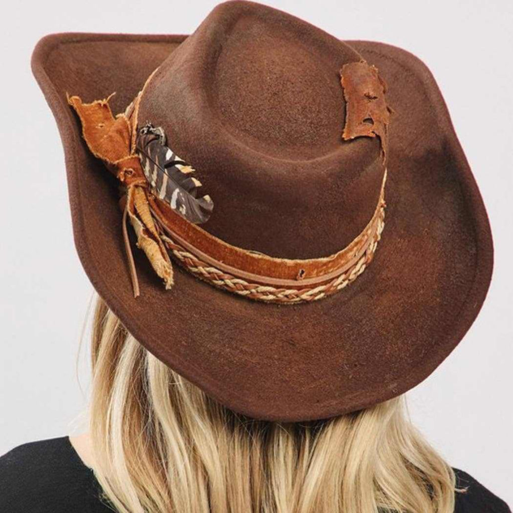 Vintage versatile shapeable cowgirl and fedora hat with feather and distressed fabric band in brown