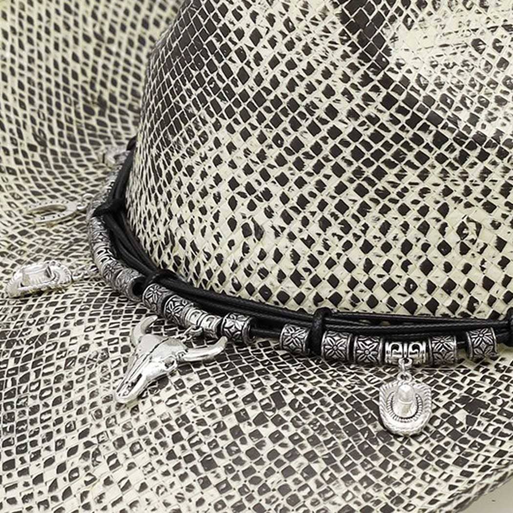 Handmade vintage cowboy hat featuring a textured woven design, black and white colors, and western-themed charms.