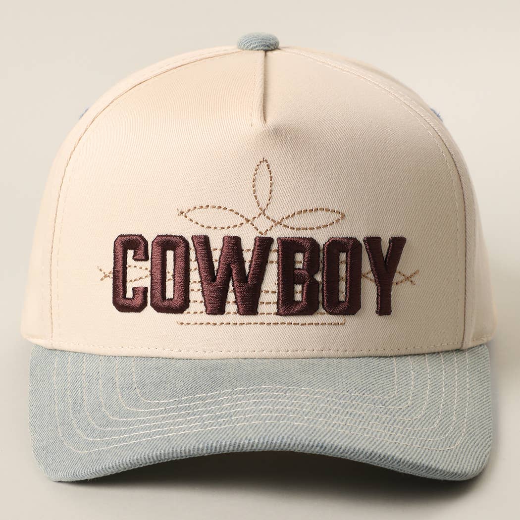 Two-tone trucker hat with "COWBOY" 3D embroidery, cream front, blue denim visor, and relaxed fit. Adjustable snapback.