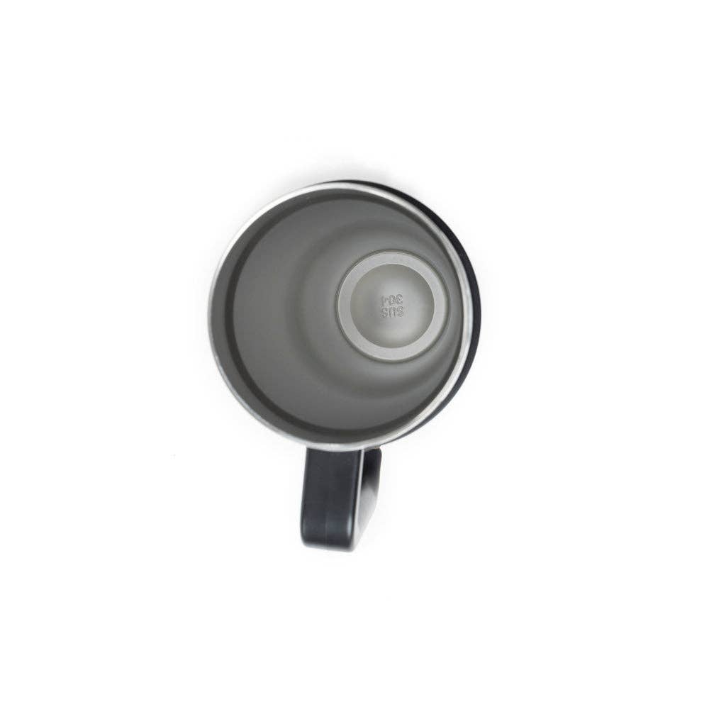 Black and white cowhide-patterned tumbler with a chocolate brown handle and spill-resistant lid.