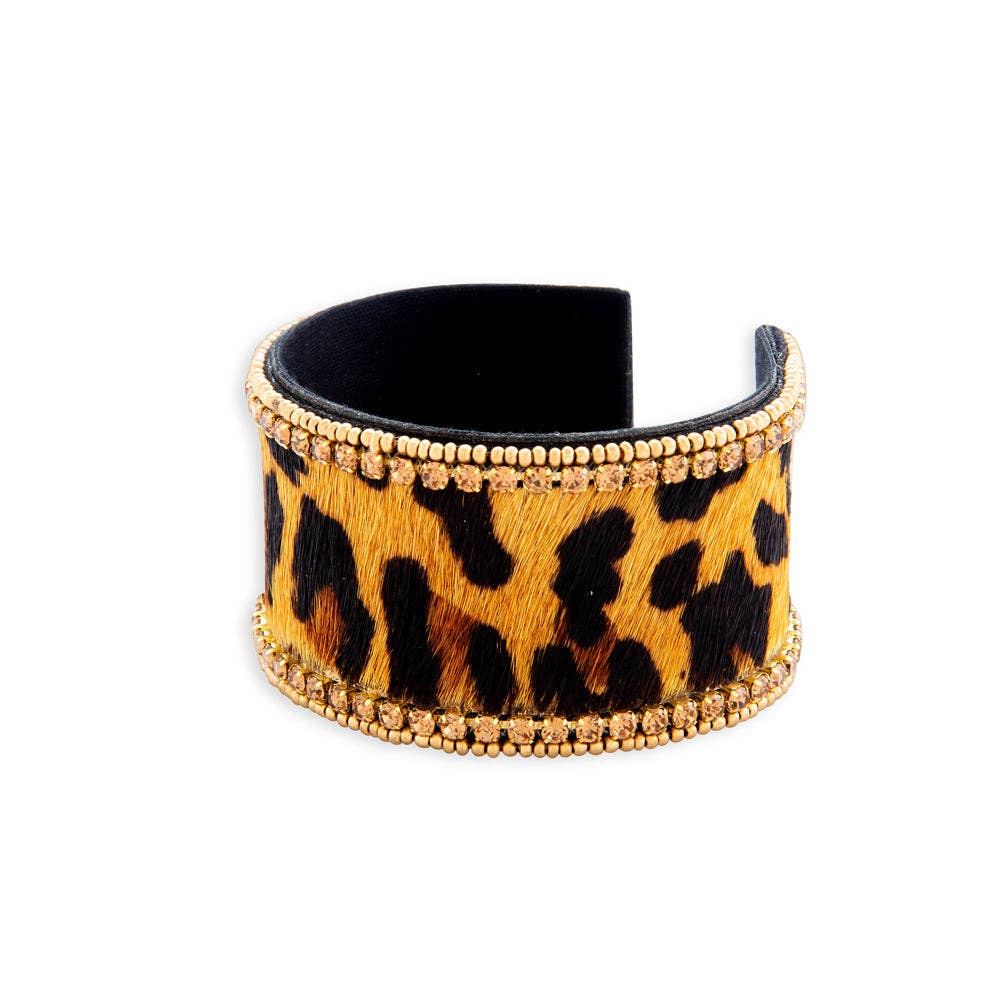 Chunky beaded bracelet featuring a bold animal print design with gold accents and a leather finish.