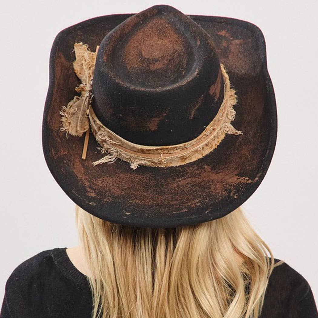 vintage versatile shapeable cowgirl fedora hat with feather and distressed fabric band worn on blonde hair