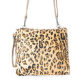 Leopard print bag with gold specks, featuring a leather and hairon design. Includes a adjustable shoulder strap.