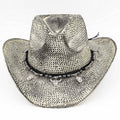 Handmade vintage cowboy hat featuring a textured black and white woven design, adorned with western-themed charms.
