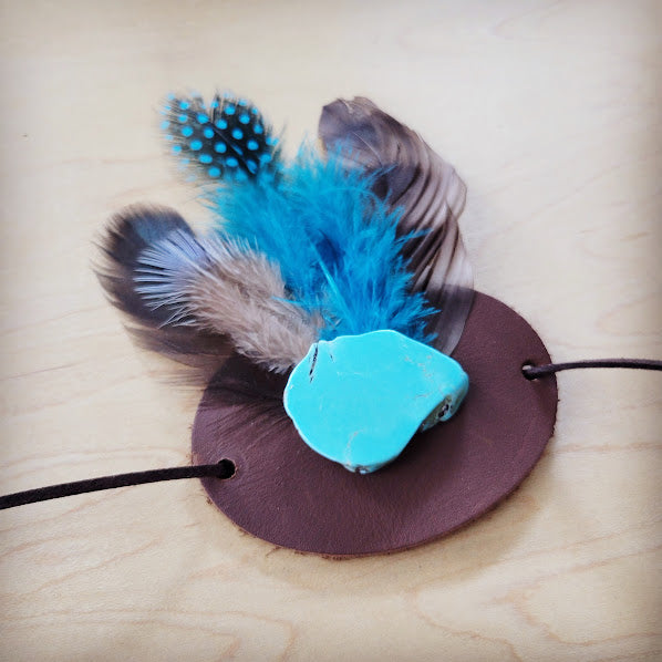 Boho Western felt hat band featuring turquoise stone, brown leather base, and assorted feathers in blue and brown.