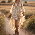 Women's Bohemian V-Neck Asymmetrical Hem Printed Long Sleeve Dress in light floral pattern, cinched waist, and flowy asymmetric hem.