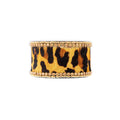 Chunky beaded bracelet featuring a leopard print design, with gold-tone embellishments and varying textures.