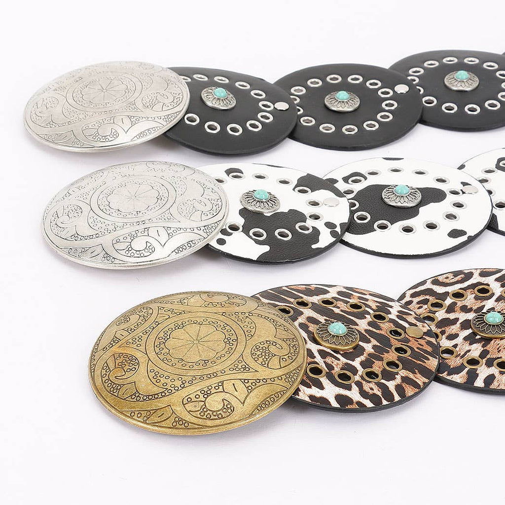 Faux leather disc belt with decorative metal and stone accents in bohemian design