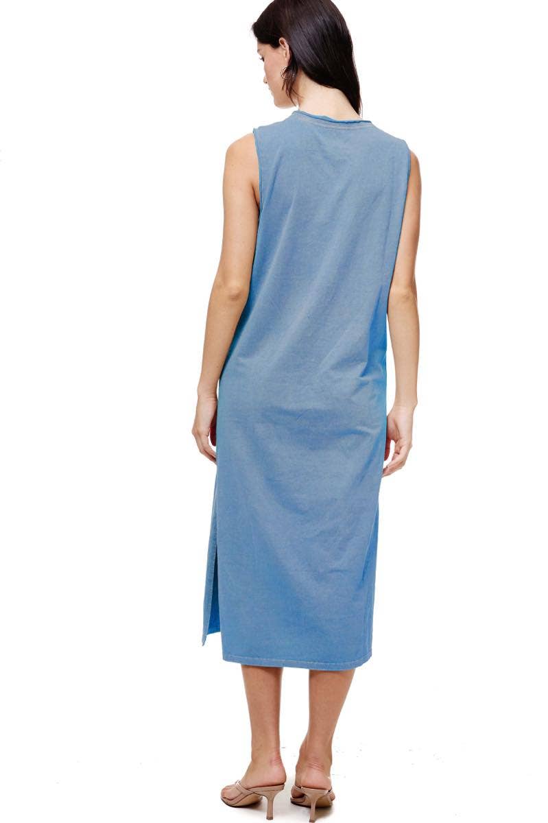 Soft blue muscle tank midi dress with slits, featuring an American flag graphic on the front. Worn casually.