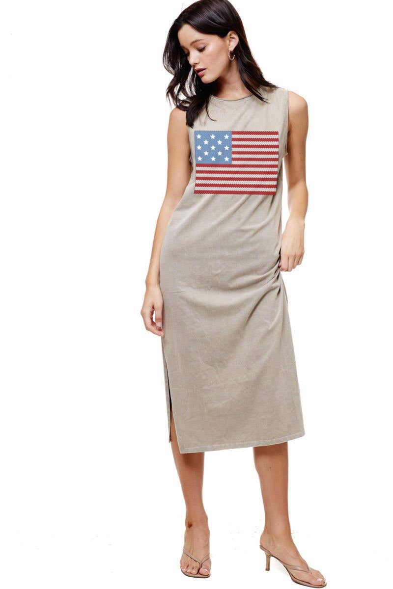 Soft mineral-washed beige midi dress features a bold American flag graphic, sleeveless design, and side slits.