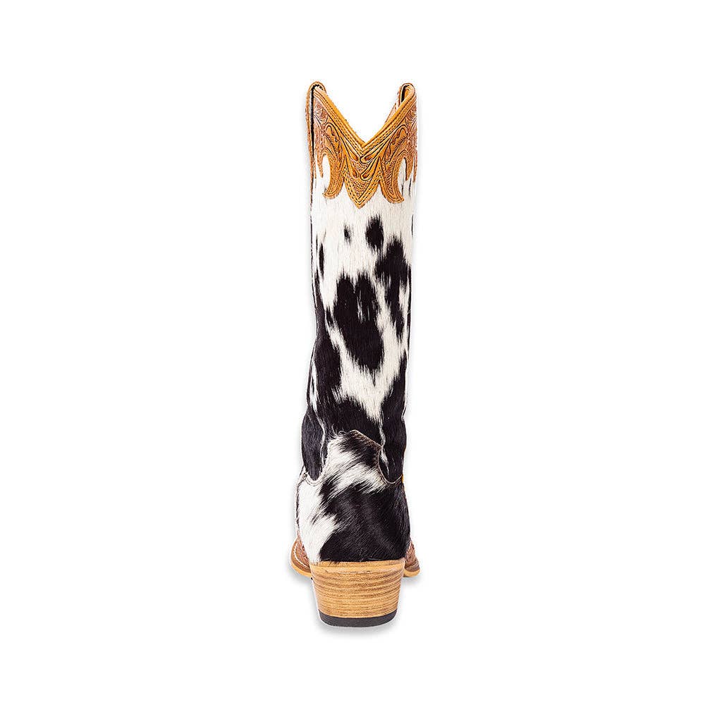 High-top cowboy boots with a black and white hair-on hide upper and hand-tooled honey leather detailing.