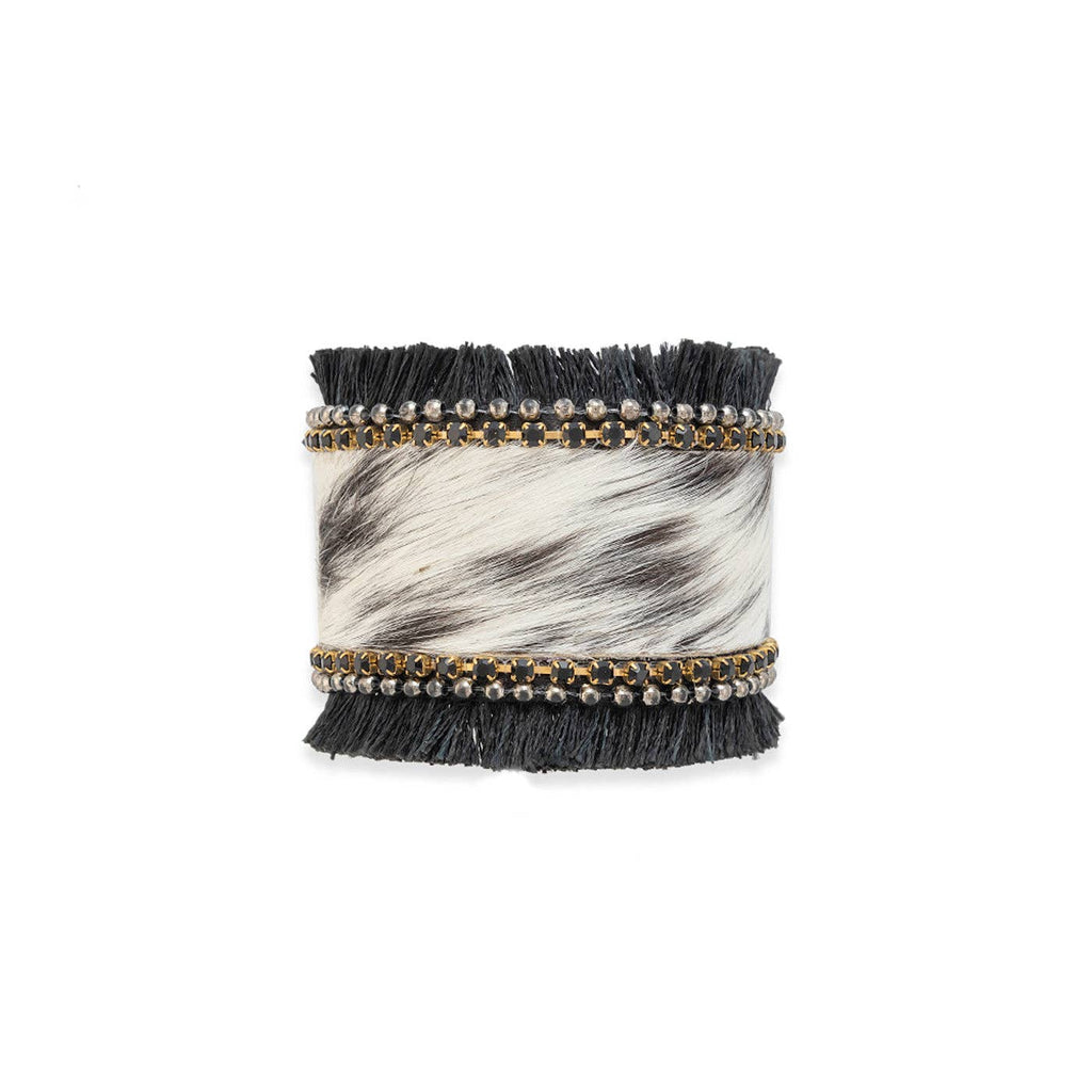 Hair-on hide cuff bracelet with onyx black stones, silver beads, and coal black fringe, featuring a bold, western style.