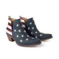 Vintage blue leather booties with patriotic stars-and-stripes design, stacked heel, and almond toe shape.