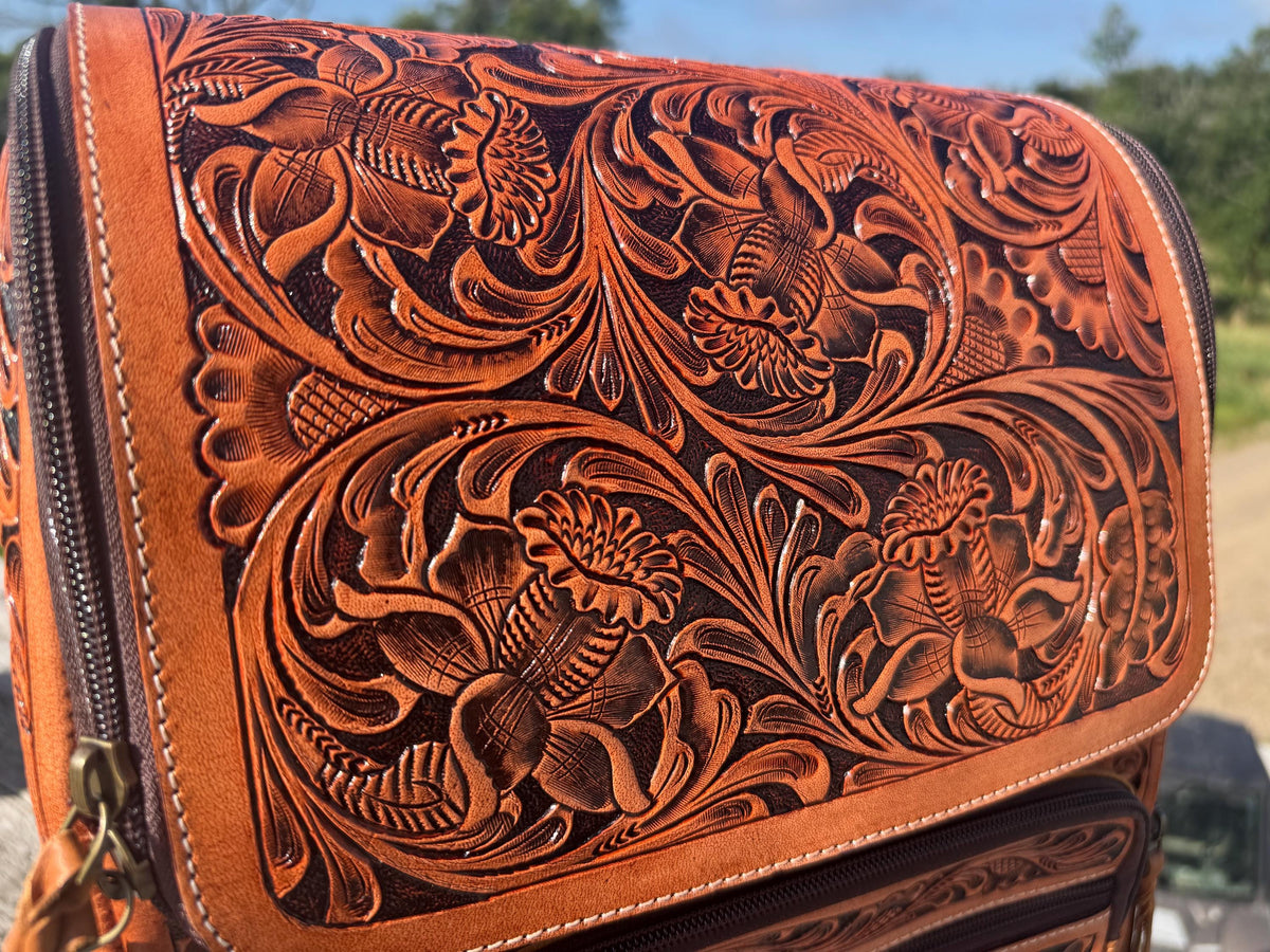 Fully Tooled Western Backpack with intricate floral embossing, crafted from genuine leather in a warm brown tone.